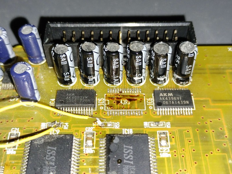One DAC replaced, working on the next, and another final one remains. Brown residue under the missing chip is old burnt flux.